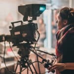 Videographer films scene in a studio